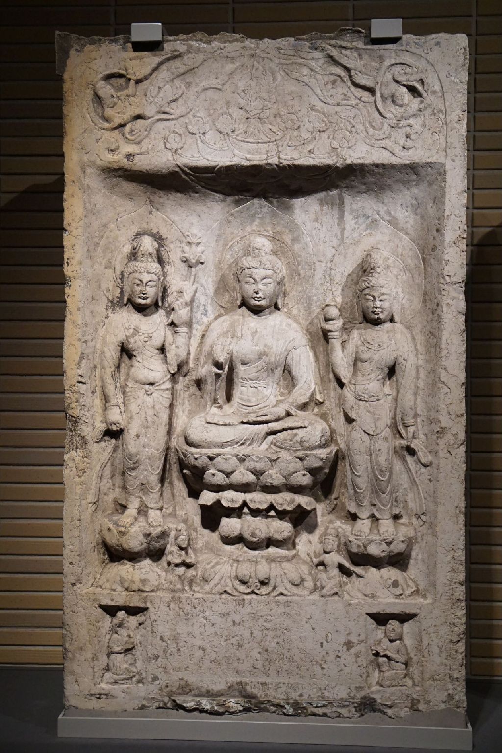 Miniature of The Buddha Amitābha with Two Attendants in a Niche